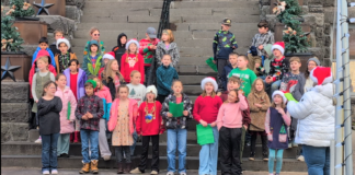 Young voices ring out at Historic Crook County Courthouse with holiday caroling